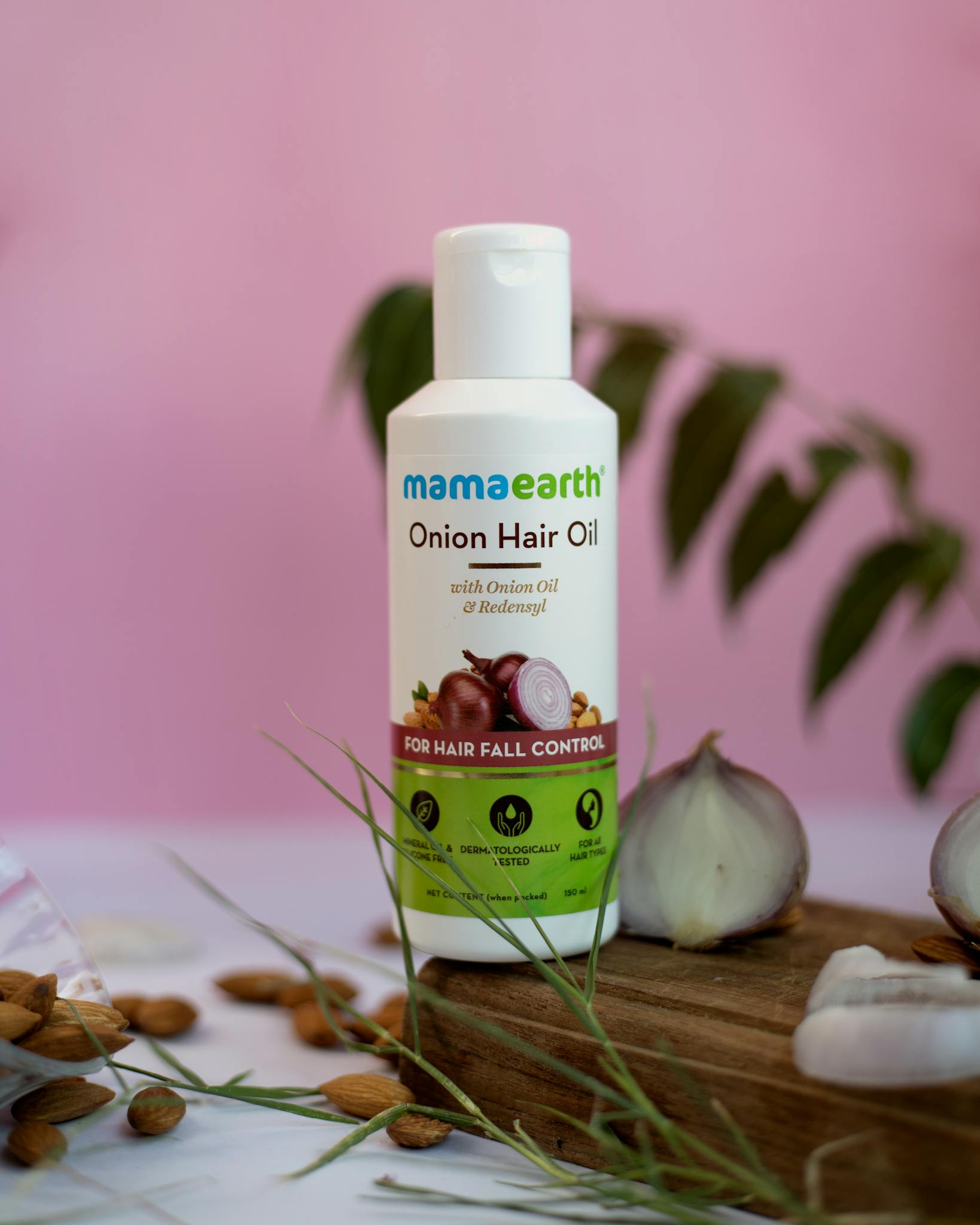 Onion hair oil for hair fall control with natural ingredients and therapeutic benefits.